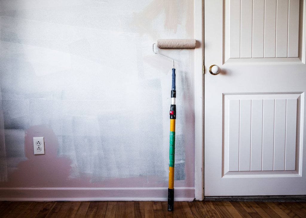 Walled painter using roller brush by a professional painter in perth