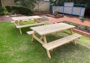 wooden picnic tables with bar benches